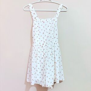 4/$10🎄Forever 21 White Romper w Ditsy Rose Pattern and Criss Cross Straps